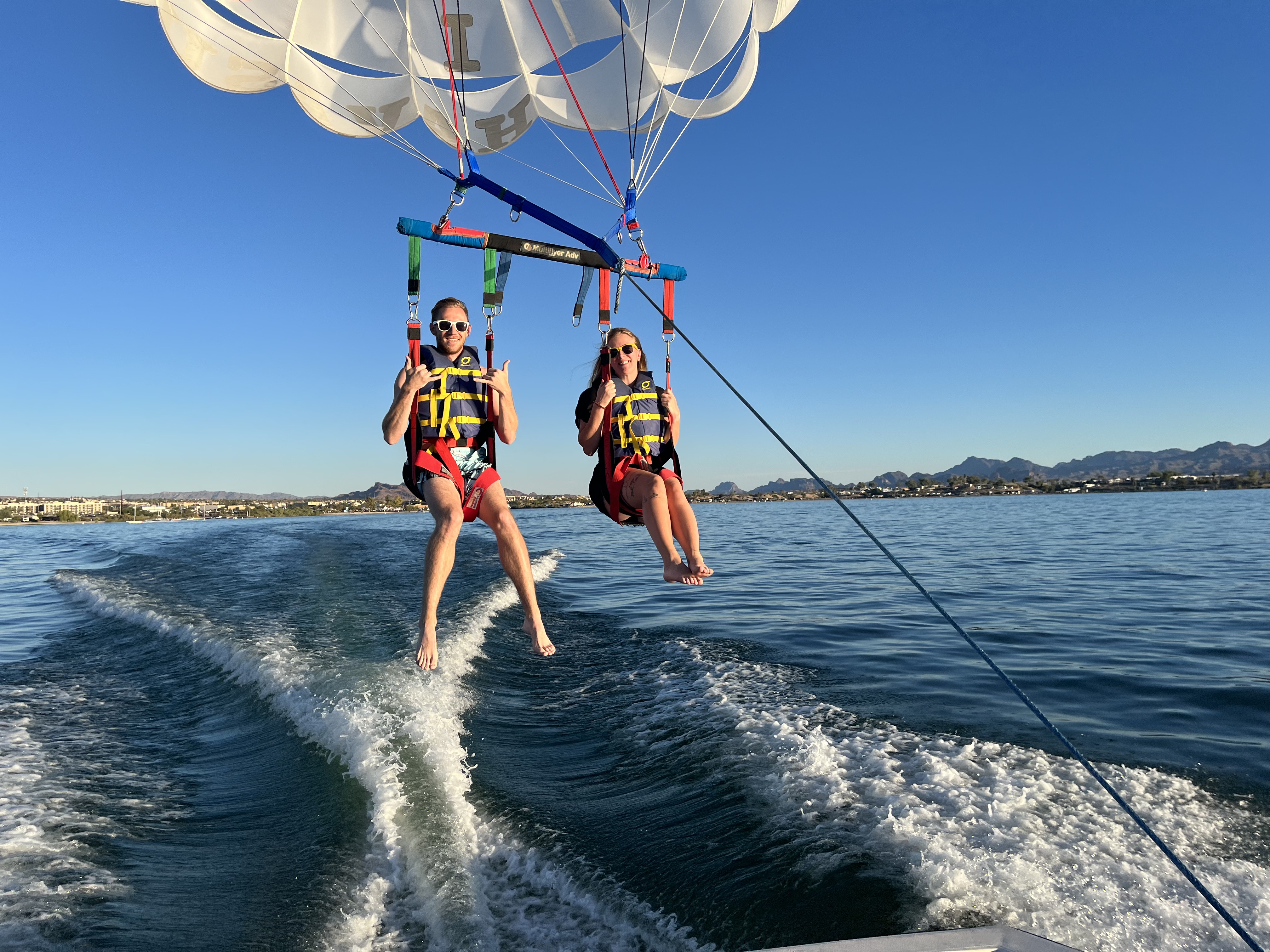 Happy couple after parasailing adventure